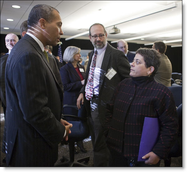 Loren Sure expressing her interests in STEM education to Governor Patrick