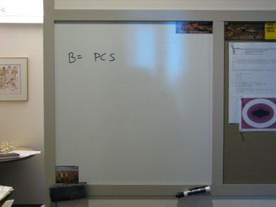 Picture of whiteboard with equation 